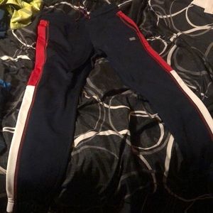 Size S for men it’s dark blue color with red and white in the side good